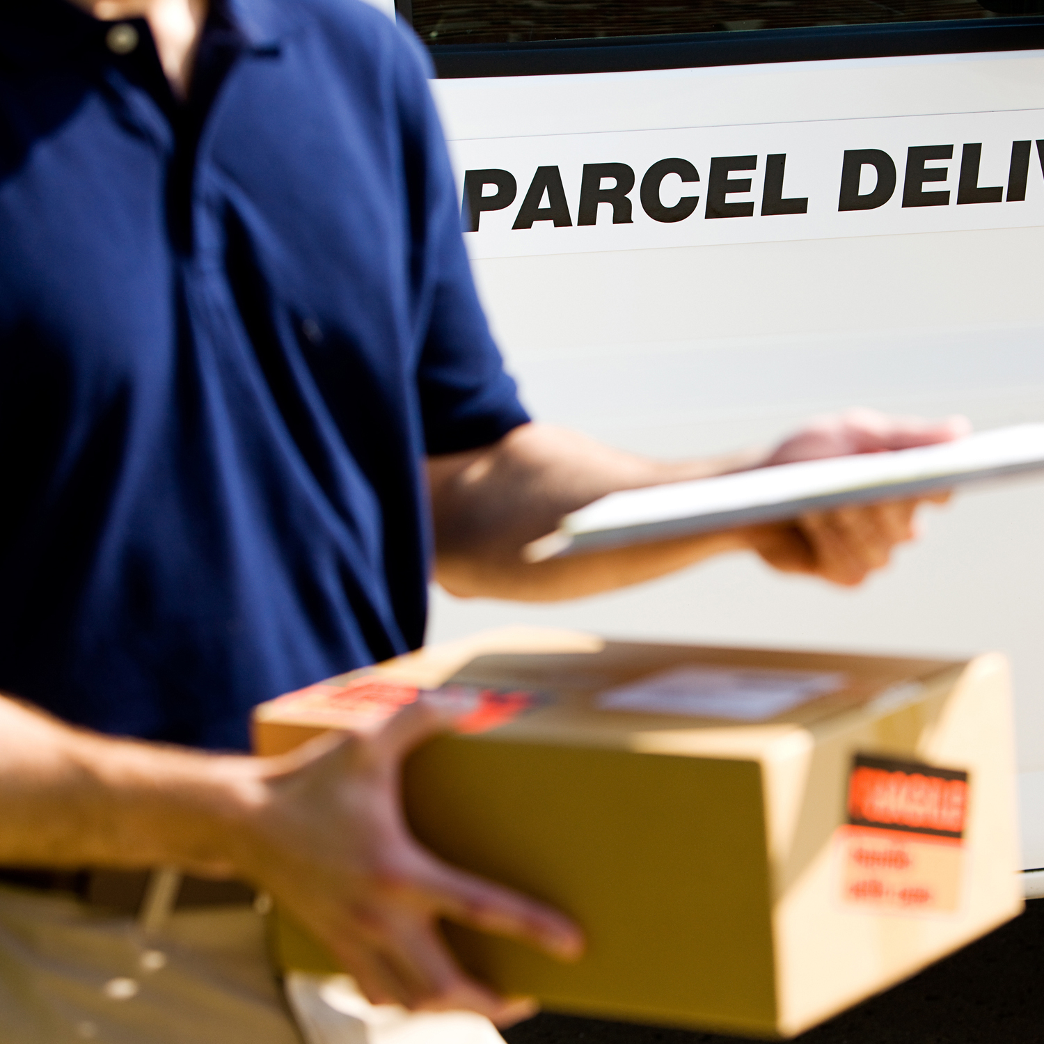 Person delivering parcel to customer