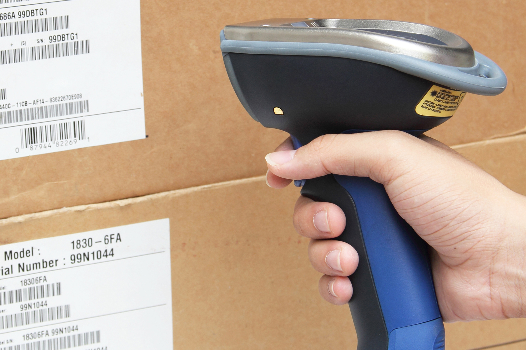 Order fulfilment process, man scanning packages